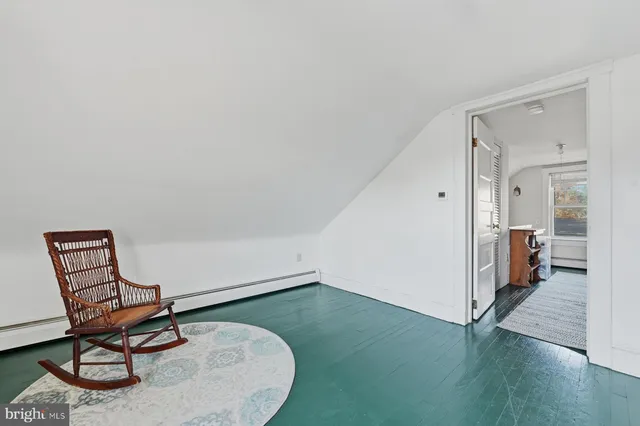 a room with furniture and wooden floor