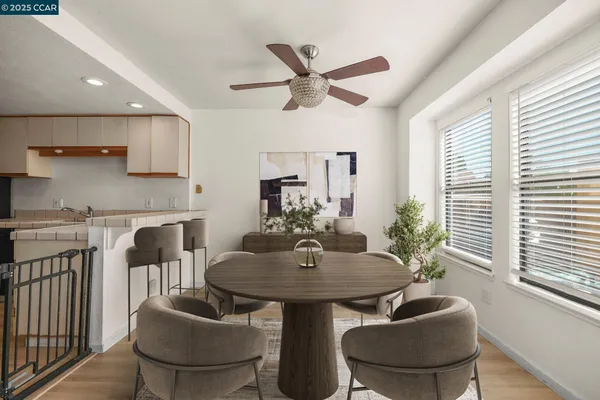 a dining room with furniture and window