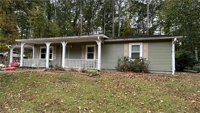front view of a house with a bench
