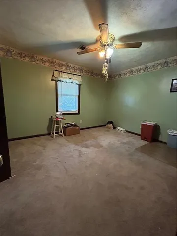 a view of a room with furniture and chandelier