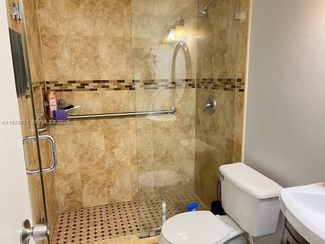 17530 Northwest 68th Avenue, Unit C2007 Hialeah, FL 33015 - Photo 13 of 18 a bathroom with a toilet and a shower