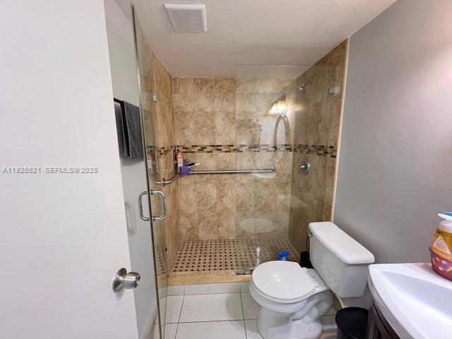17530 Northwest 68th Avenue, Unit C2007 Hialeah, FL 33015 - Photo 14 of 18 a bathroom with a toilet and a shower