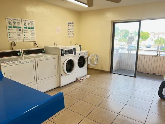 17530 Northwest 68th Avenue, Unit C2007 Hialeah, FL 33015 - Photo 16 of 18 a utility room with dryer and washer