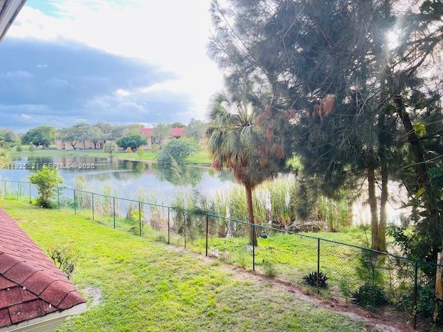 17530 Northwest 68th Avenue, Unit C2007 Hialeah, FL 33015 - Photo 2 of 18 a view of lake with green space