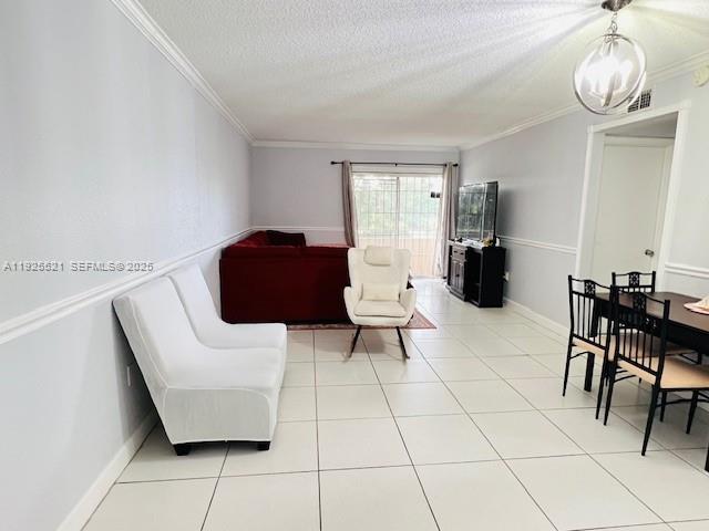 17530 Northwest 68th Avenue, Unit C2007 Hialeah, FL 33015 - Photo 7 of 18 a living room with furniture and a window