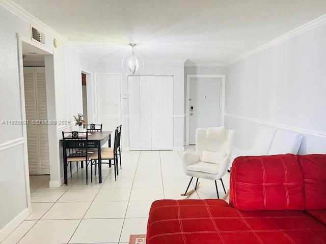 17530 Northwest 68th Avenue, Unit C2007 Hialeah, FL 33015 - Photo 10 of 18 a view of a dining room with furniture and wooden floor