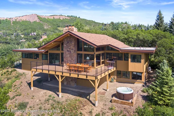 an aerial view of residential houses with outdoor space and river