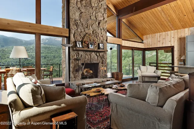 a view of a swimming pool and outdoor seating
