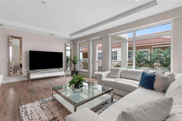 a bathroom with a sink a large mirror and vanity