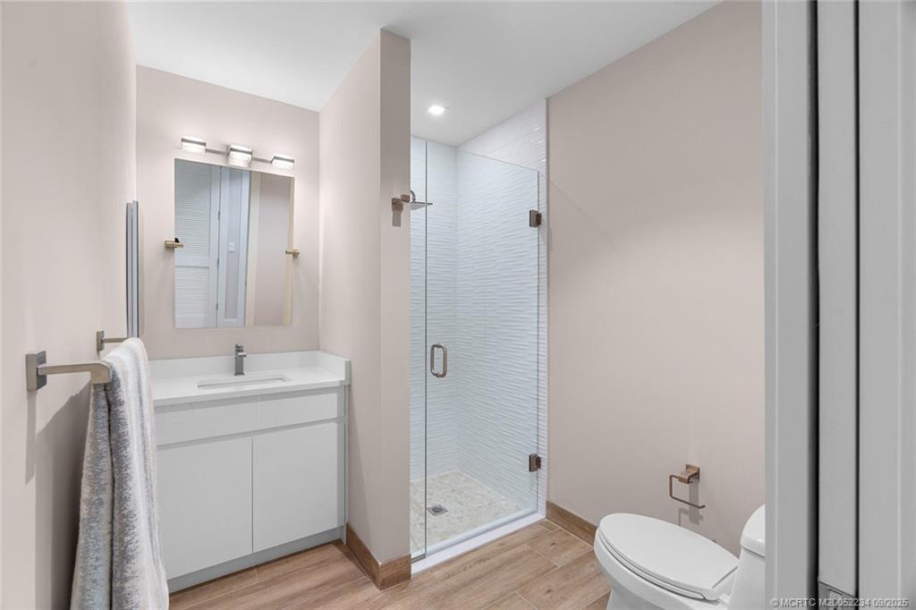 Undisclosed Address Stuart, FL 34994 - Photo 25 of 58 a bathroom with a sink toilet and shower