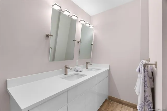 a room with a bed and a mirror