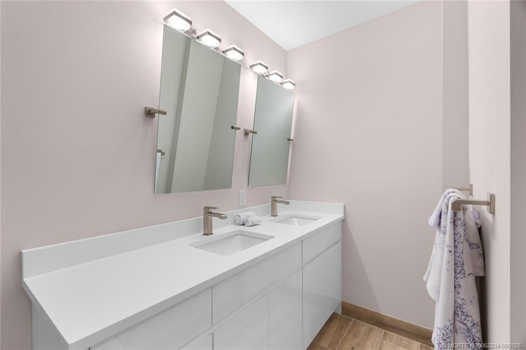 Undisclosed Address Stuart, FL 34994 - Photo 36 of 58 a bathroom with a sink vanity and a mirror