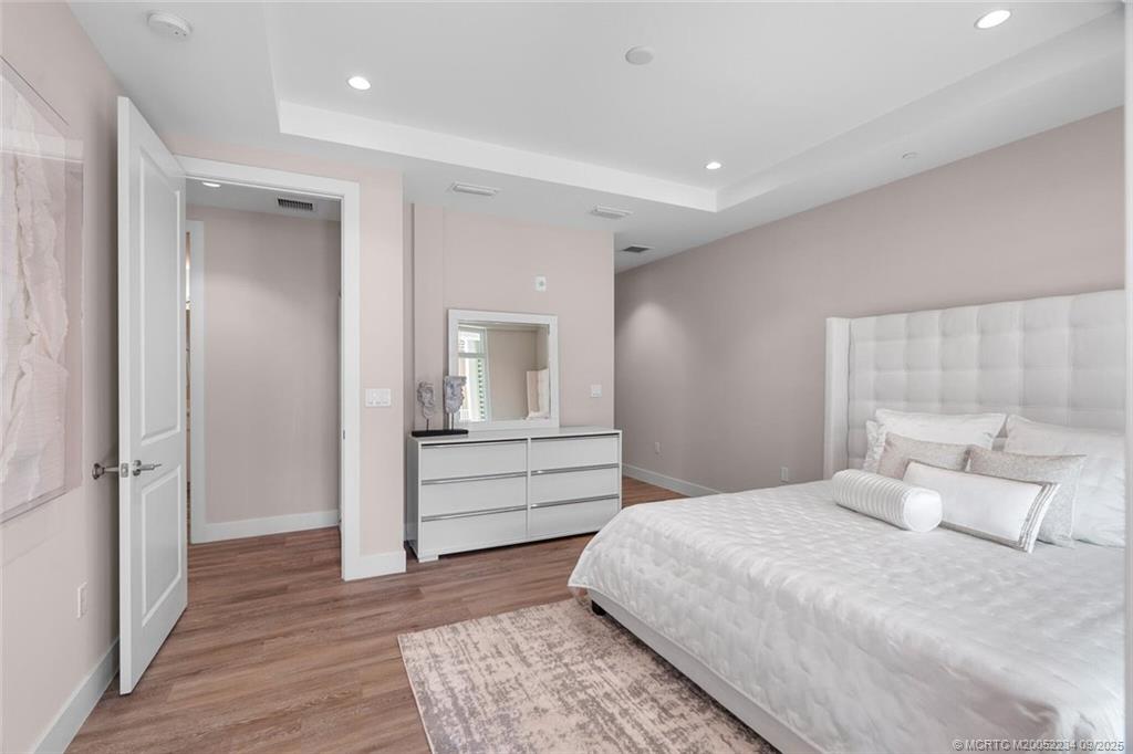 Undisclosed Address Stuart, FL 34994 - Photo 39 of 58 a room with a bed and a mirror