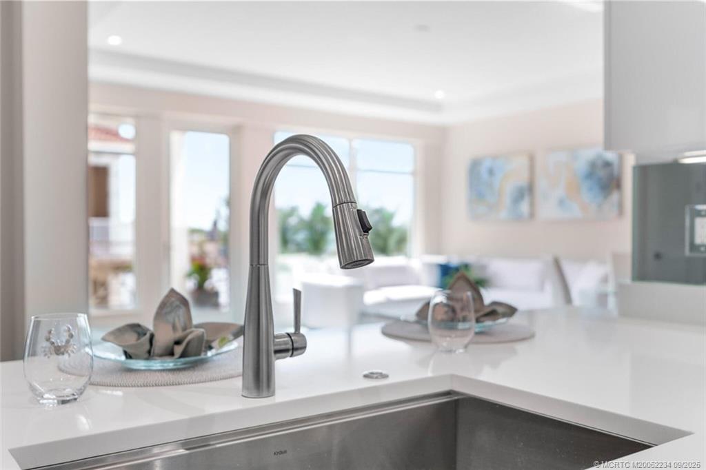 Undisclosed Address Stuart, FL 34994 - Photo 51 of 58 a kitchen with a faucet a sink and wooden floor