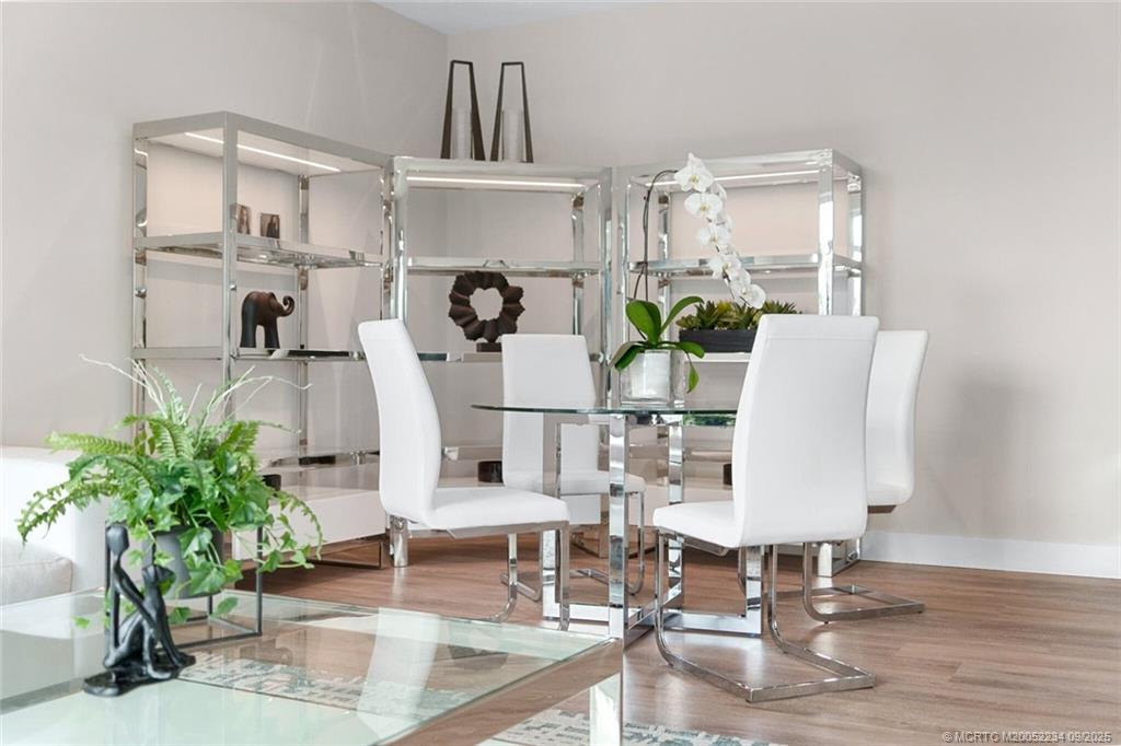 Undisclosed Address Stuart, FL 34994 - Photo 56 of 58 a living room with furniture a chandelier and kitchen view