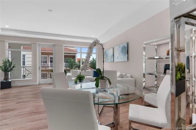 a view of a livingroom with furniture and a flat screen tv