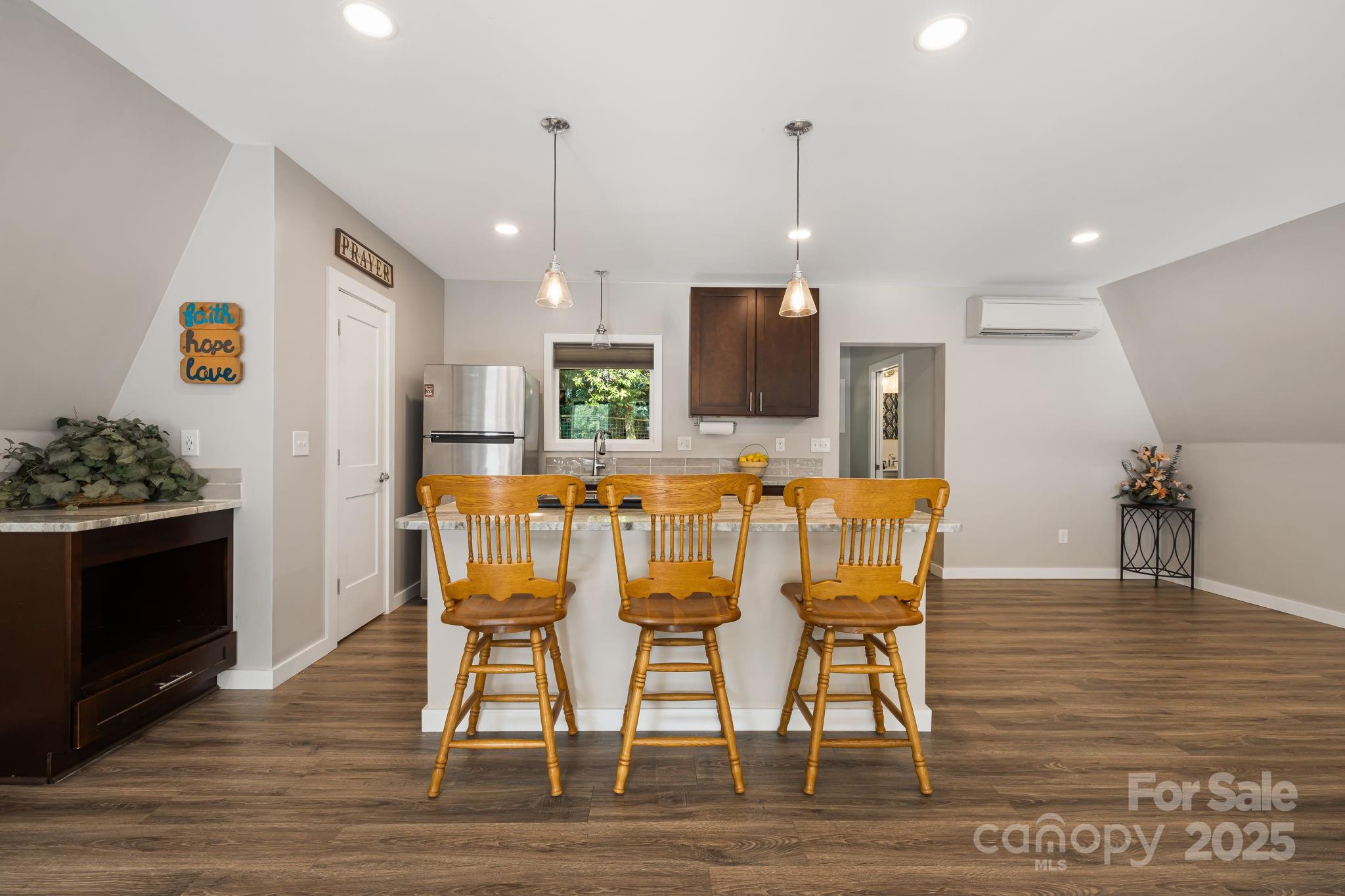 1101 Line Runner Ridge Road Rosman, NC 28772 - Photo 11 of 47 a dining room with furniture and wooden floor