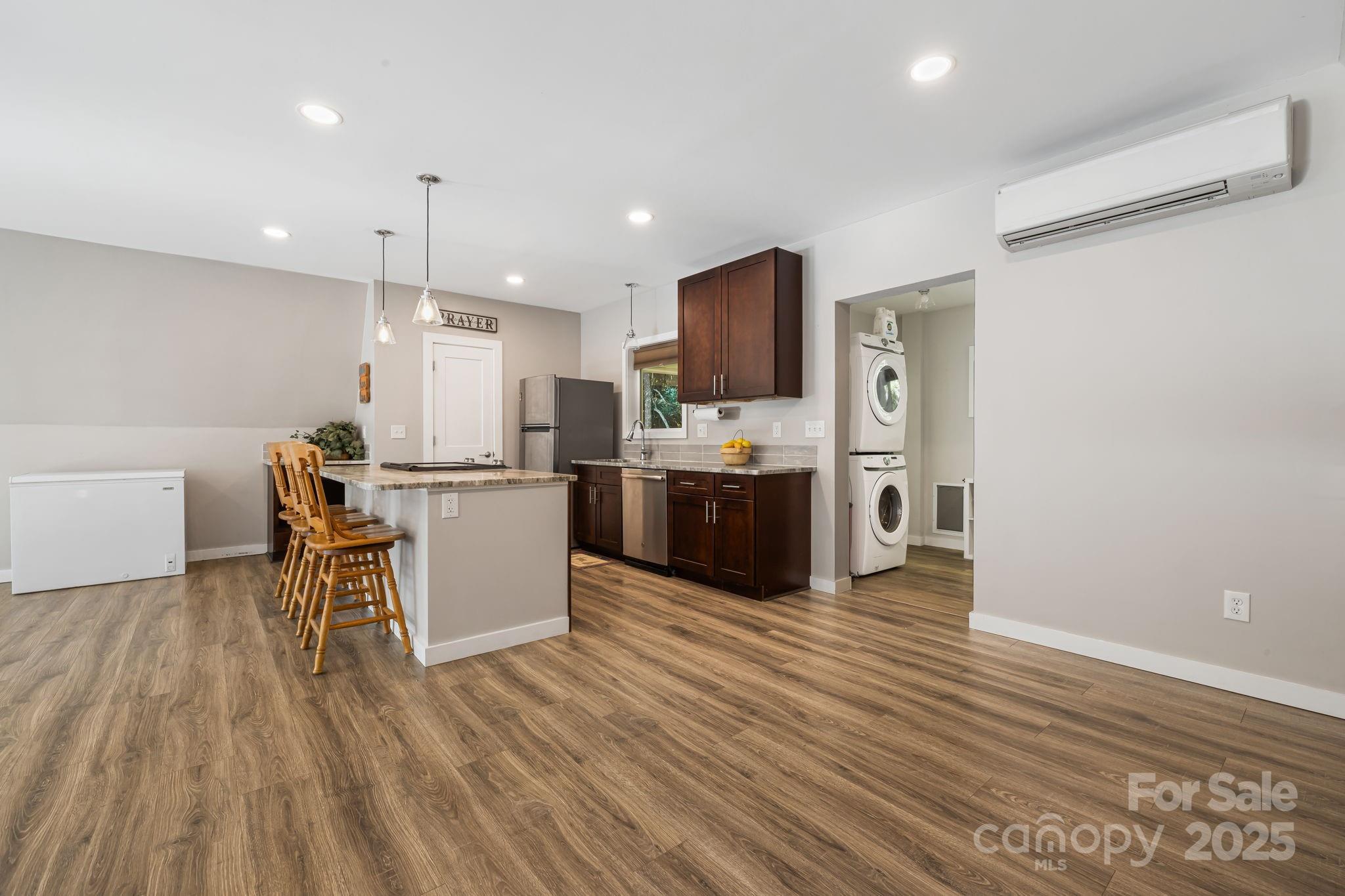 1101 Line Runner Ridge Road Rosman, NC 28772 - Photo 15 of 47 a kitchen with a table chairs refrigerator and microwave