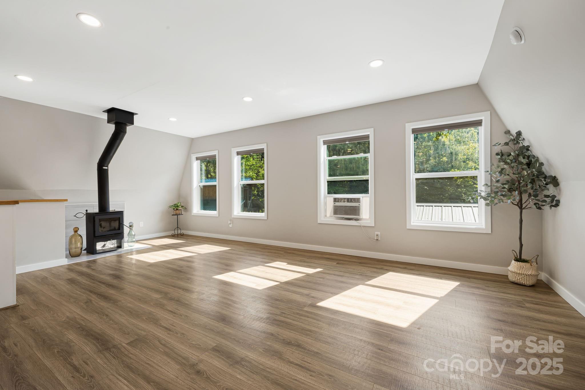 1101 Line Runner Ridge Road Rosman, NC 28772 - Photo 20 of 47 a view of empty room with a window and wooden floor
