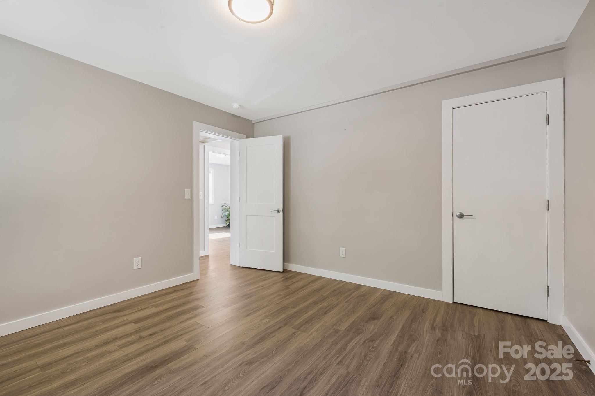 1101 Line Runner Ridge Road Rosman, NC 28772 - Photo 25 of 47 a view of an empty room with wooden floor