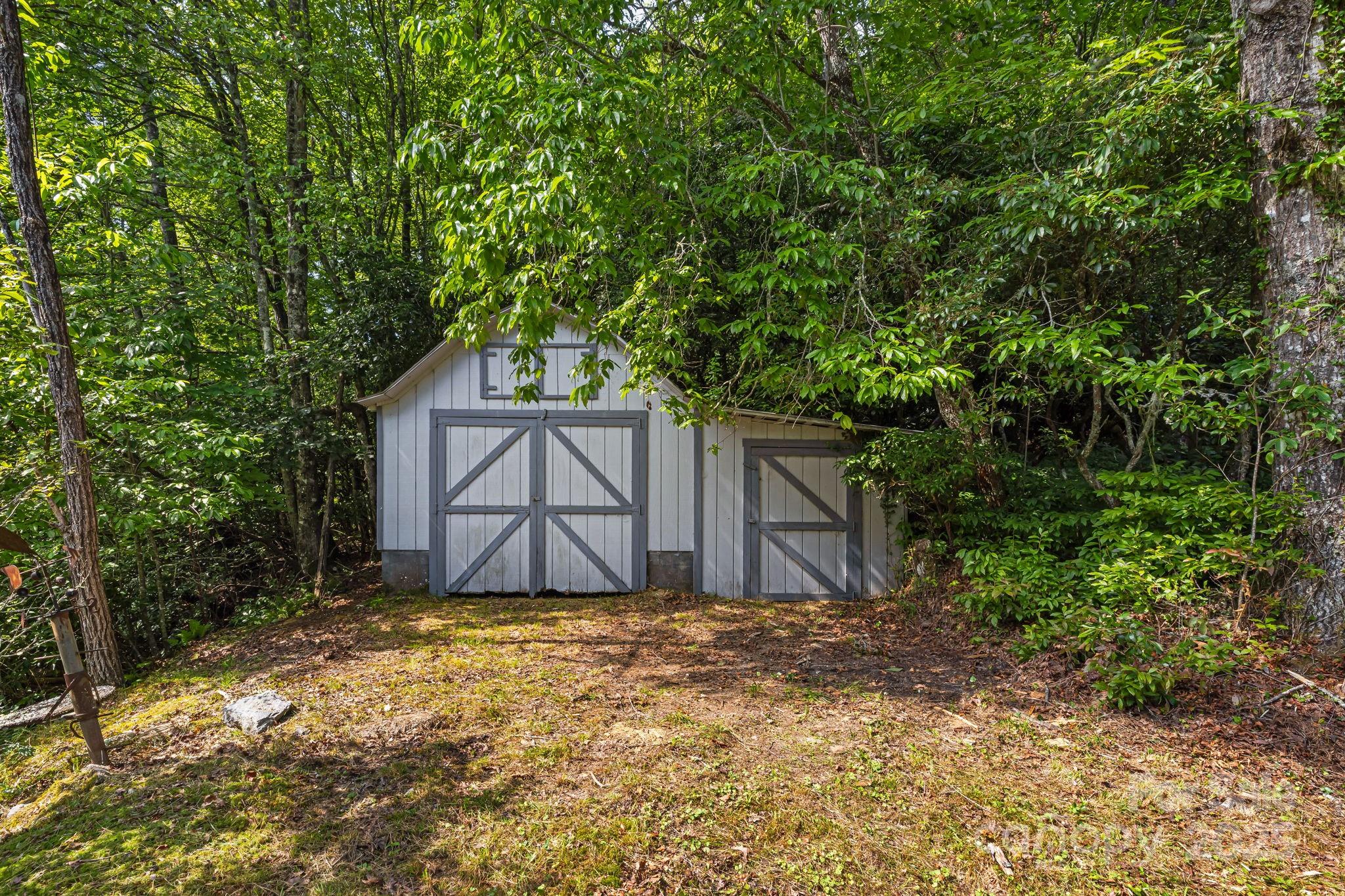 1101 Line Runner Ridge Road Rosman, NC 28772 - Photo 33 of 47 a front view of house with yard and trees around