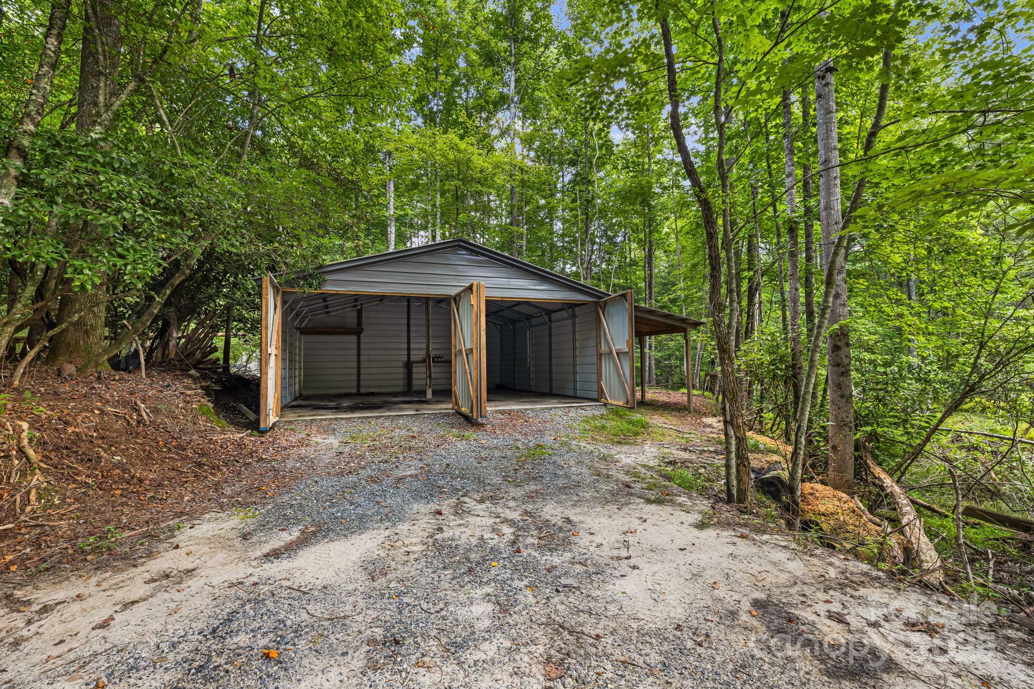 1101 Line Runner Ridge Road Rosman, NC 28772 - Photo 35 of 47 a view of a house with a yard and large tree