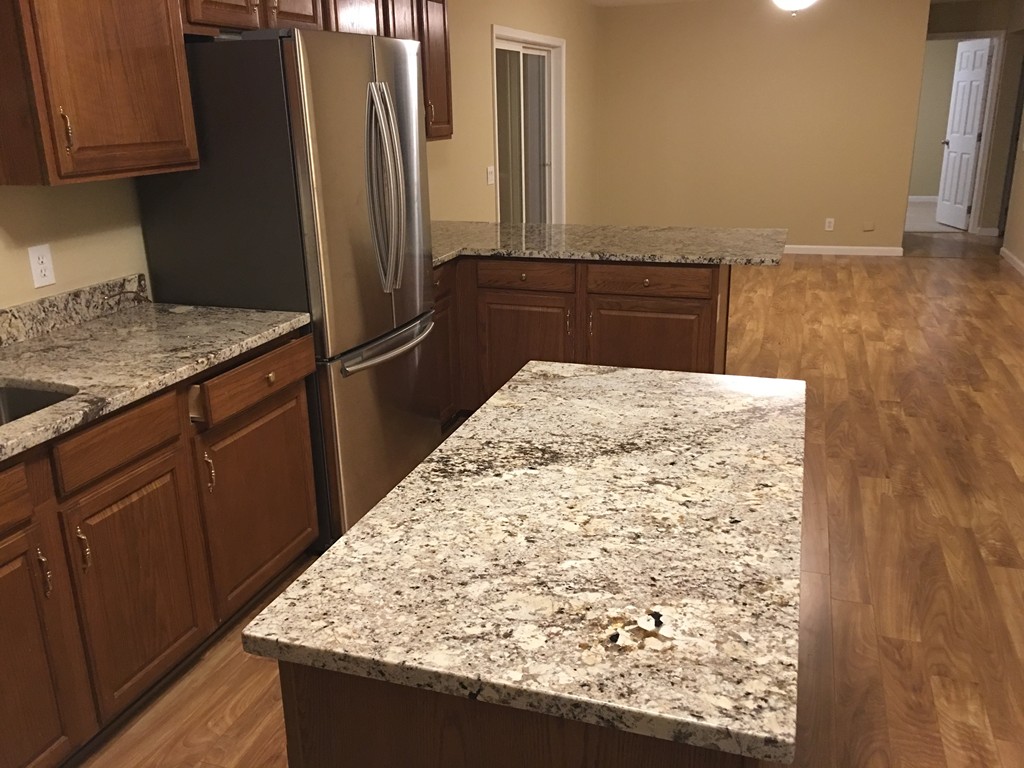 195 Barre Road Phillipston, MA 01331 - Photo 9 of 9 a kitchen with stainless steel appliances granite countertop a refrigerator and a stove