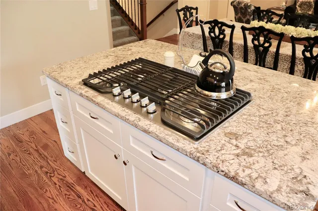 a close view of a stove top oven and sitting space