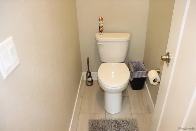 a white toilet sitting next to a white sink