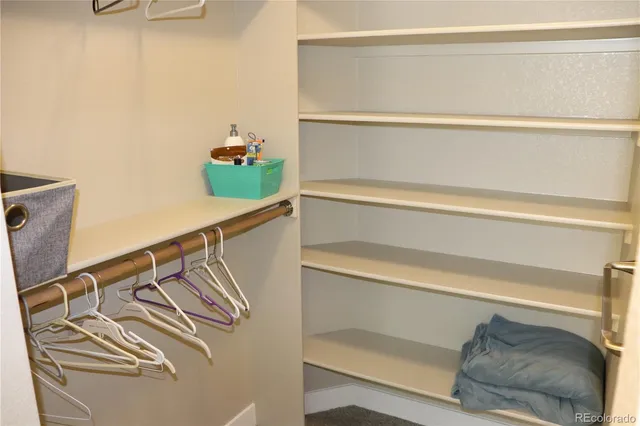 a bathroom with a sink mirror and toilet