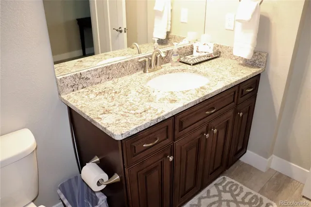 a bathroom with a toilet and a shower curtain