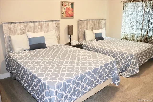 a view of a chairs and table in backyard