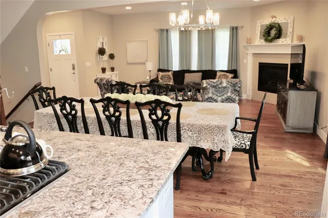 a view of a dining room with furniture and a fireplace
