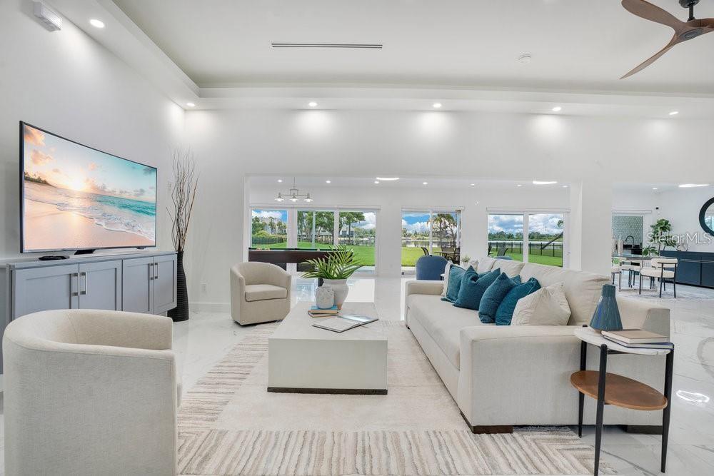 49 Interlaken Road Orlando, FL 32804 - Photo 20 of 61 a living room with furniture and a flat screen tv