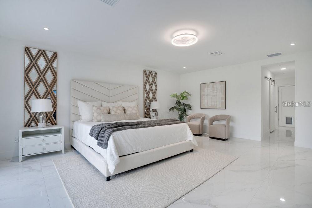 49 Interlaken Road Orlando, FL 32804 - Photo 23 of 61 a bedroom with bed and a couch