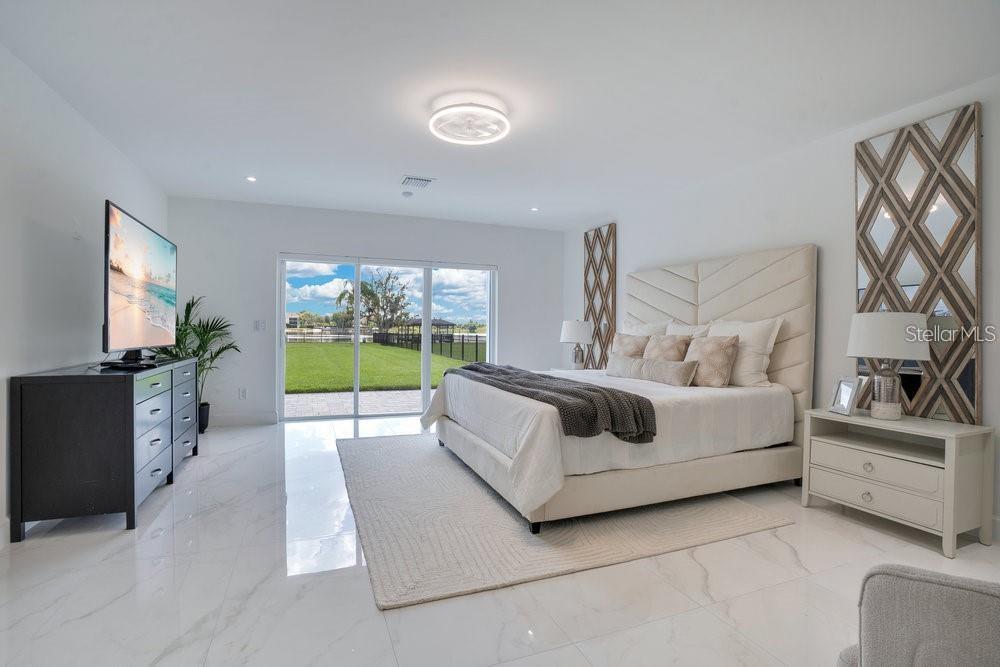 49 Interlaken Road Orlando, FL 32804 - Photo 24 of 61 a bedroom with furniture and a flat screen tv