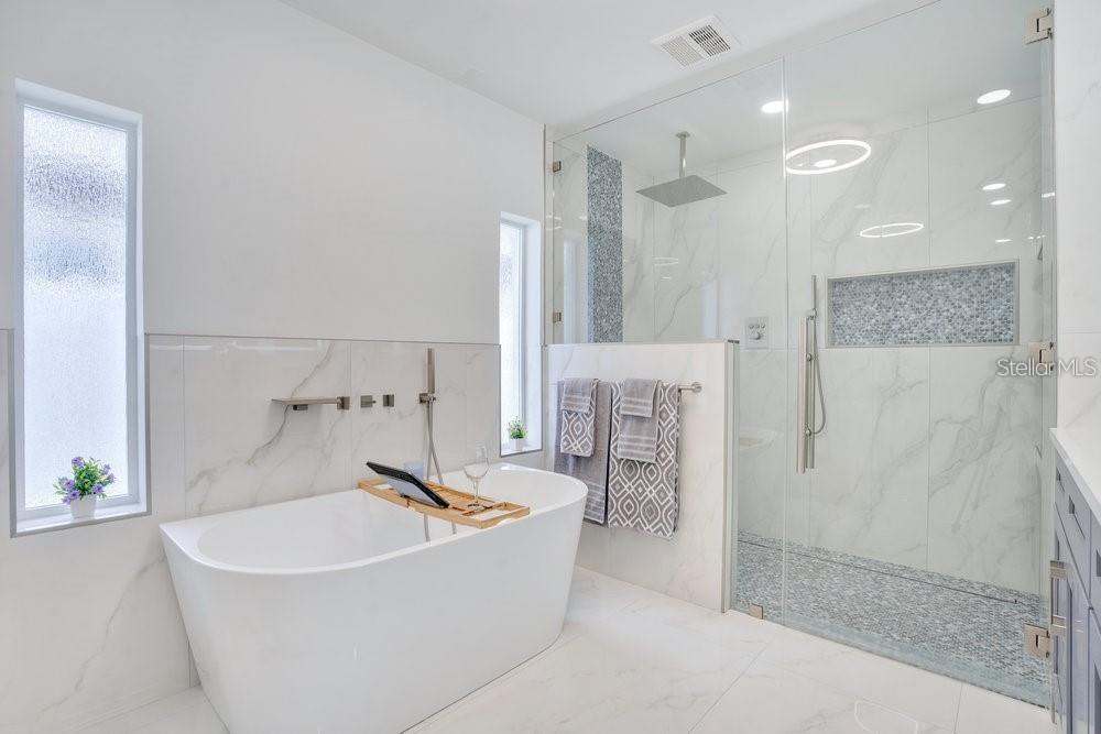 49 Interlaken Road Orlando, FL 32804 - Photo 25 of 61 a bathroom with a bathtub and a shower