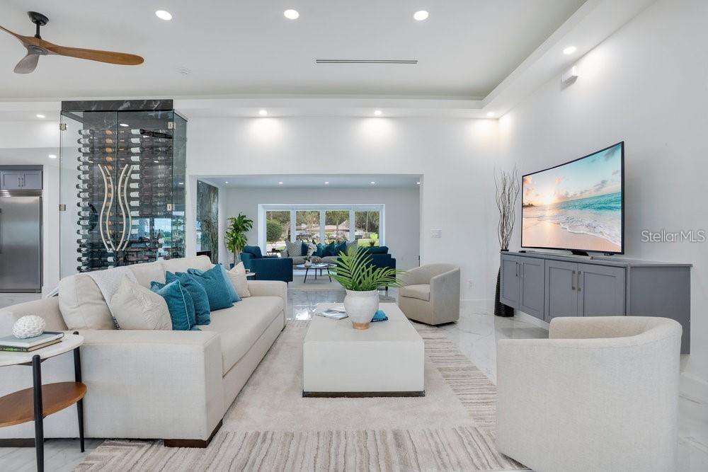 49 Interlaken Road Orlando, FL 32804 - Photo 3 of 61 a living room with furniture and a flat screen tv