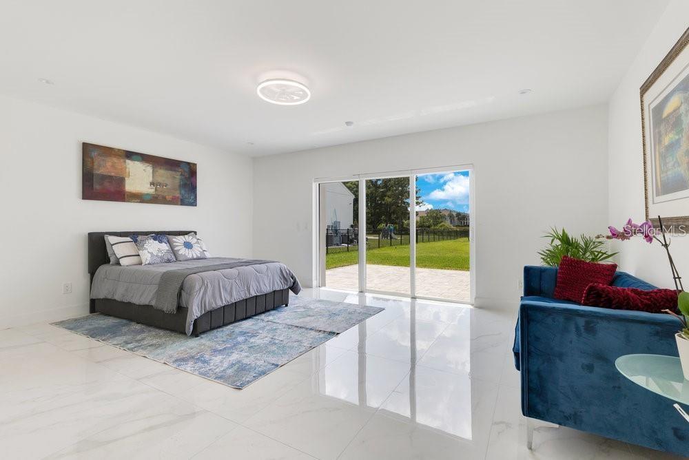 49 Interlaken Road Orlando, FL 32804 - Photo 31 of 61 a spacious bedroom with a bed and a window