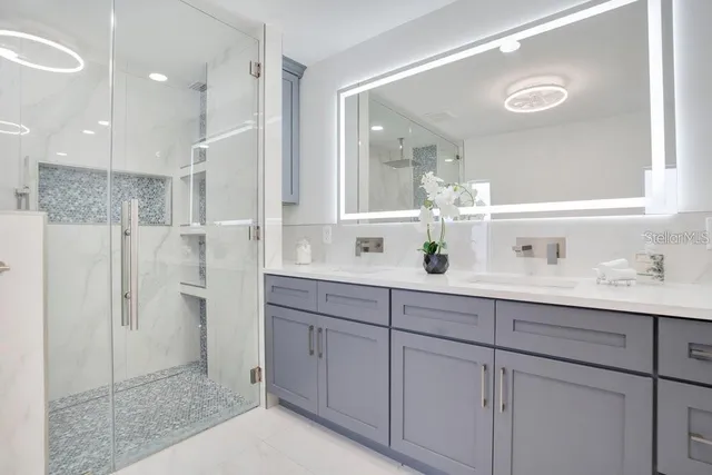 a bathroom with a sink and a mirror