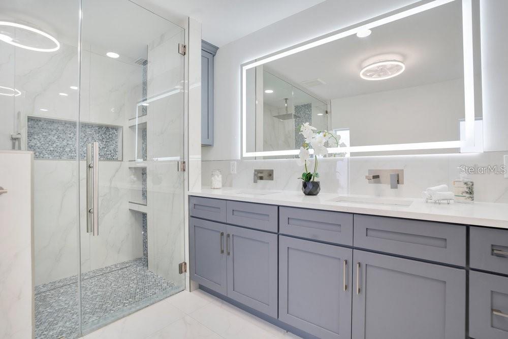 49 Interlaken Road Orlando, FL 32804 - Photo 33 of 61 a bathroom with a double vanity sink mirror and shower