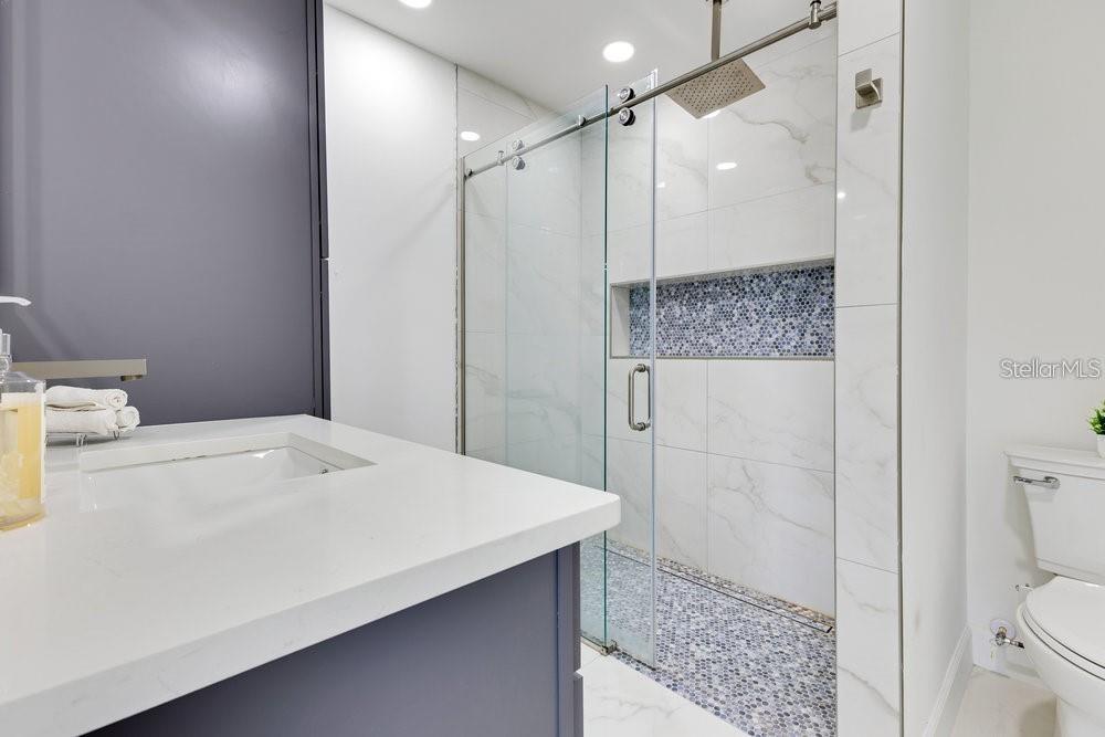 49 Interlaken Road Orlando, FL 32804 - Photo 34 of 61 a bathroom with a sink a toilet and shower