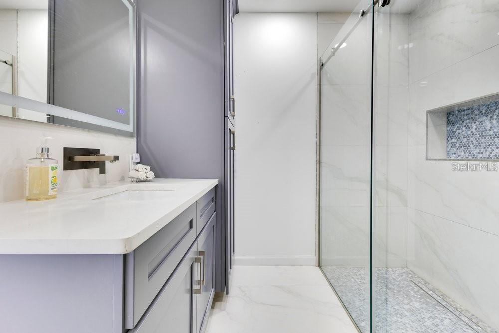 49 Interlaken Road Orlando, FL 32804 - Photo 35 of 61 a bathroom with a sink and a mirror