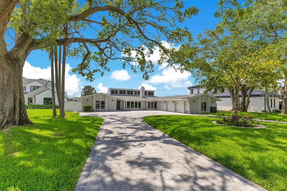 49 Interlaken Road Orlando, FL 32804 - Photo 40 of 61 a front view of a house with garden