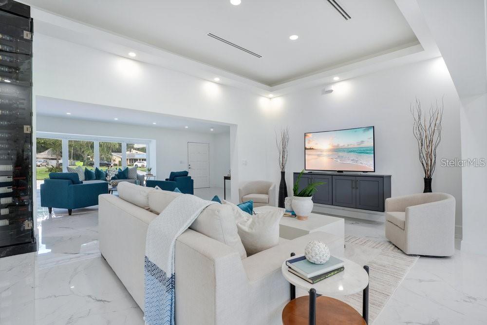 49 Interlaken Road Orlando, FL 32804 - Photo 4 of 61 a living room with furniture and a flat screen tv