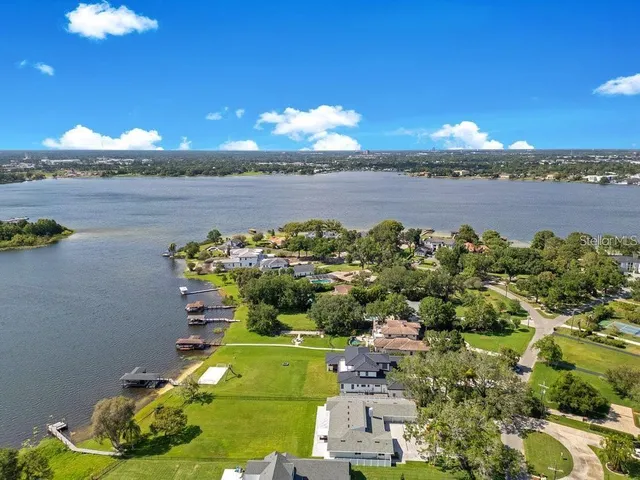 a view of a lake with a yard