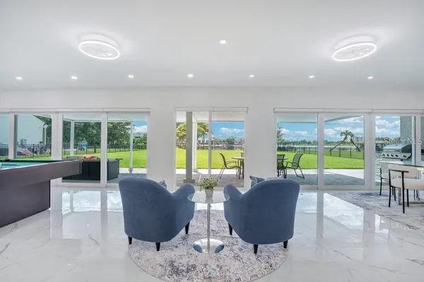 a living room with furniture and a large window