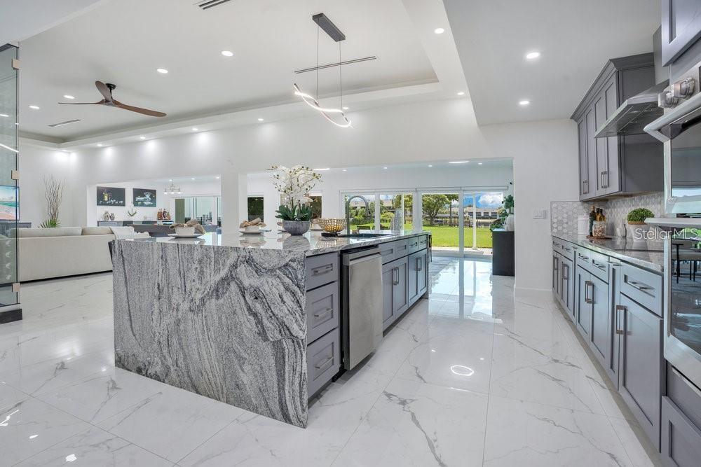 49 Interlaken Road Orlando, FL 32804 - Photo 10 of 61 a large kitchen with stainless steel appliances lots of counter space and breakfast area