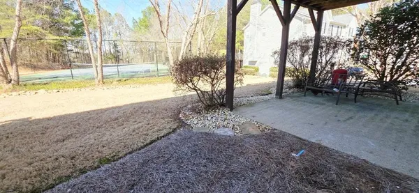 a view of a yard with an outdoor space