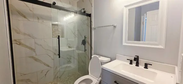 a bathroom with a sink and mirror